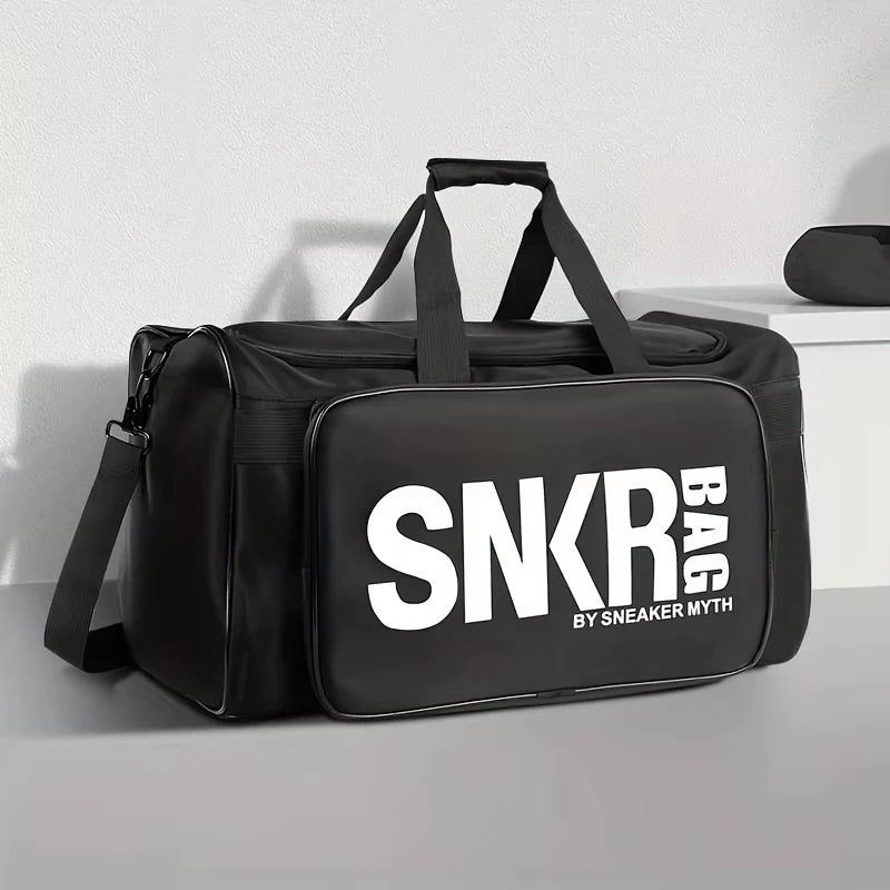 Black duffel bag with 'SNKR BAG by Sneaker Myth' logo on a white background
