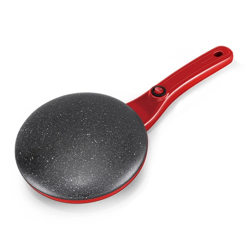 Red handheld pancake maker with black cooking surface on a white background