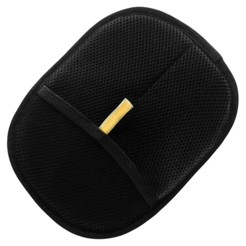 Black pet hair brush with a yellow label on a white background