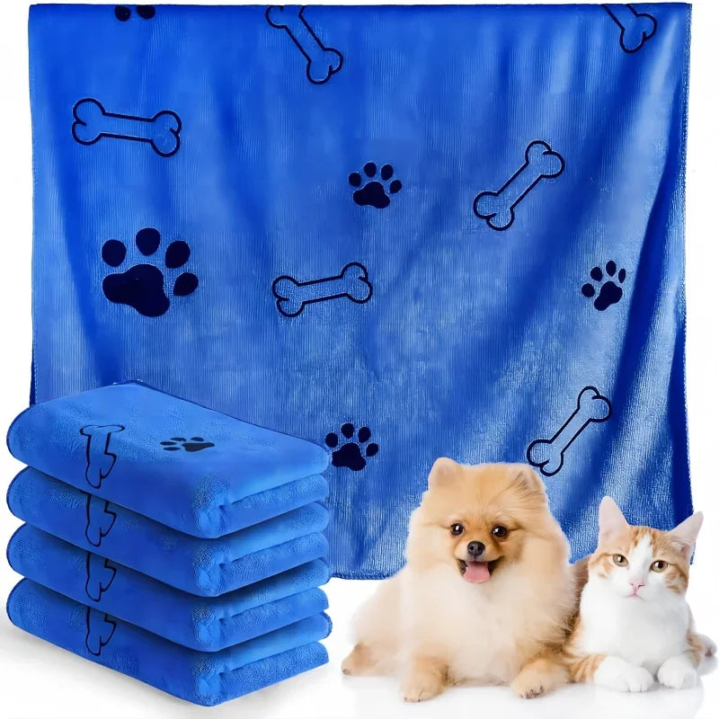 Blue pet cooling towels with paw and bone patterns, accompanied by two small dogs and a cat.