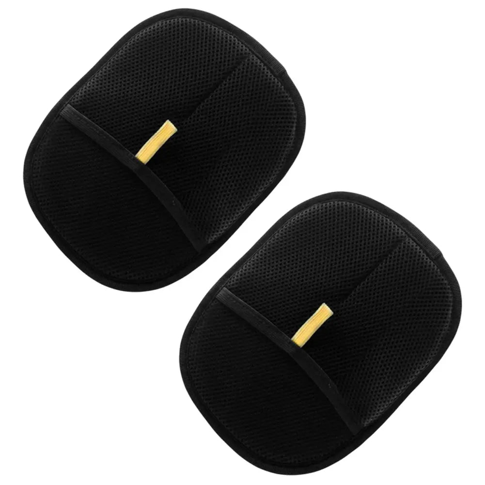 Two black pet hair brushes with gold accents on a white background