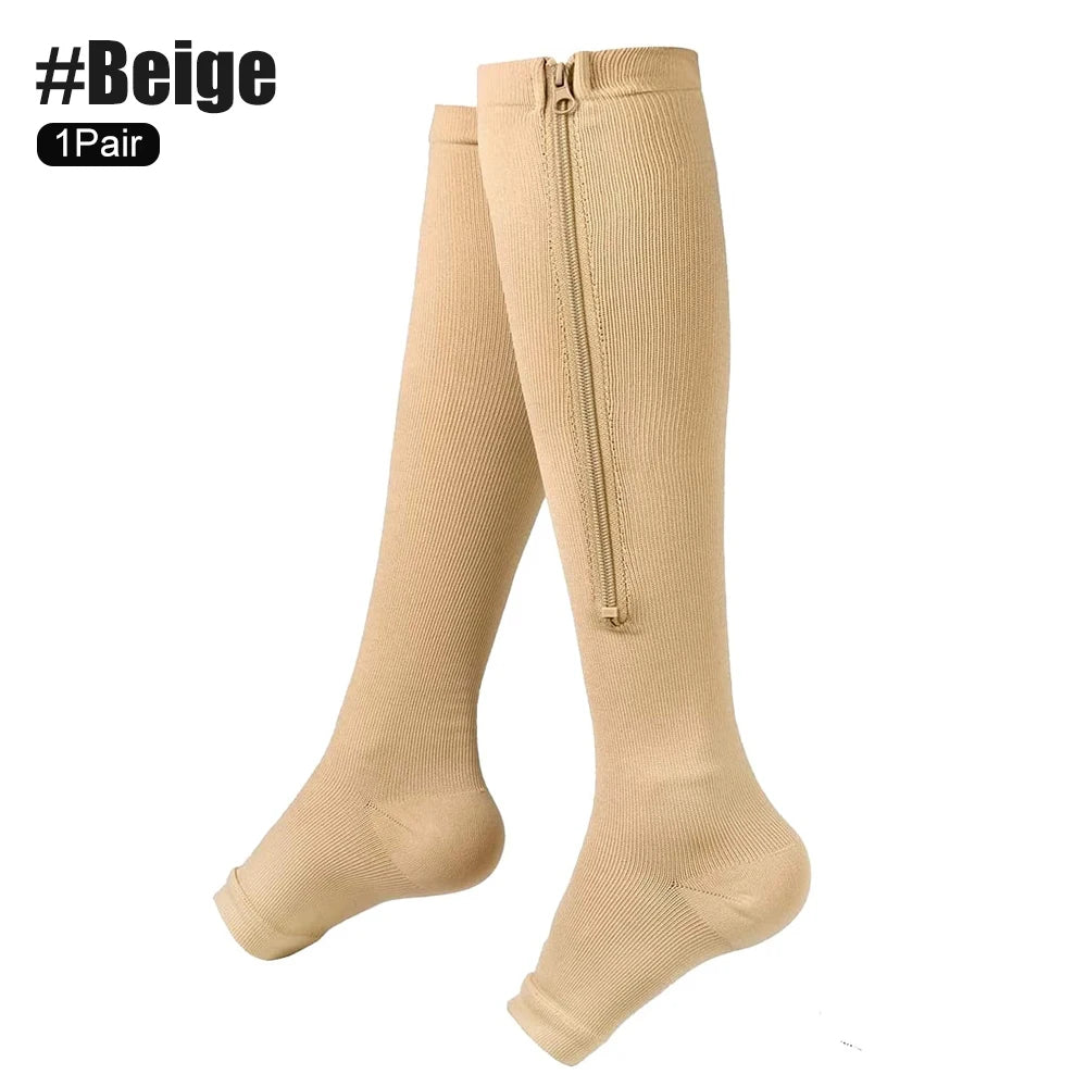 Beige knee-high compression socks with a zipper on a white background