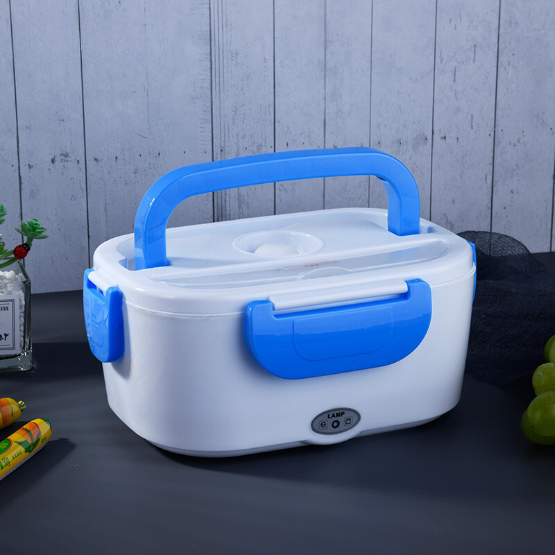 White and blue electric lunch box on a dark surface with a light gray wooden background