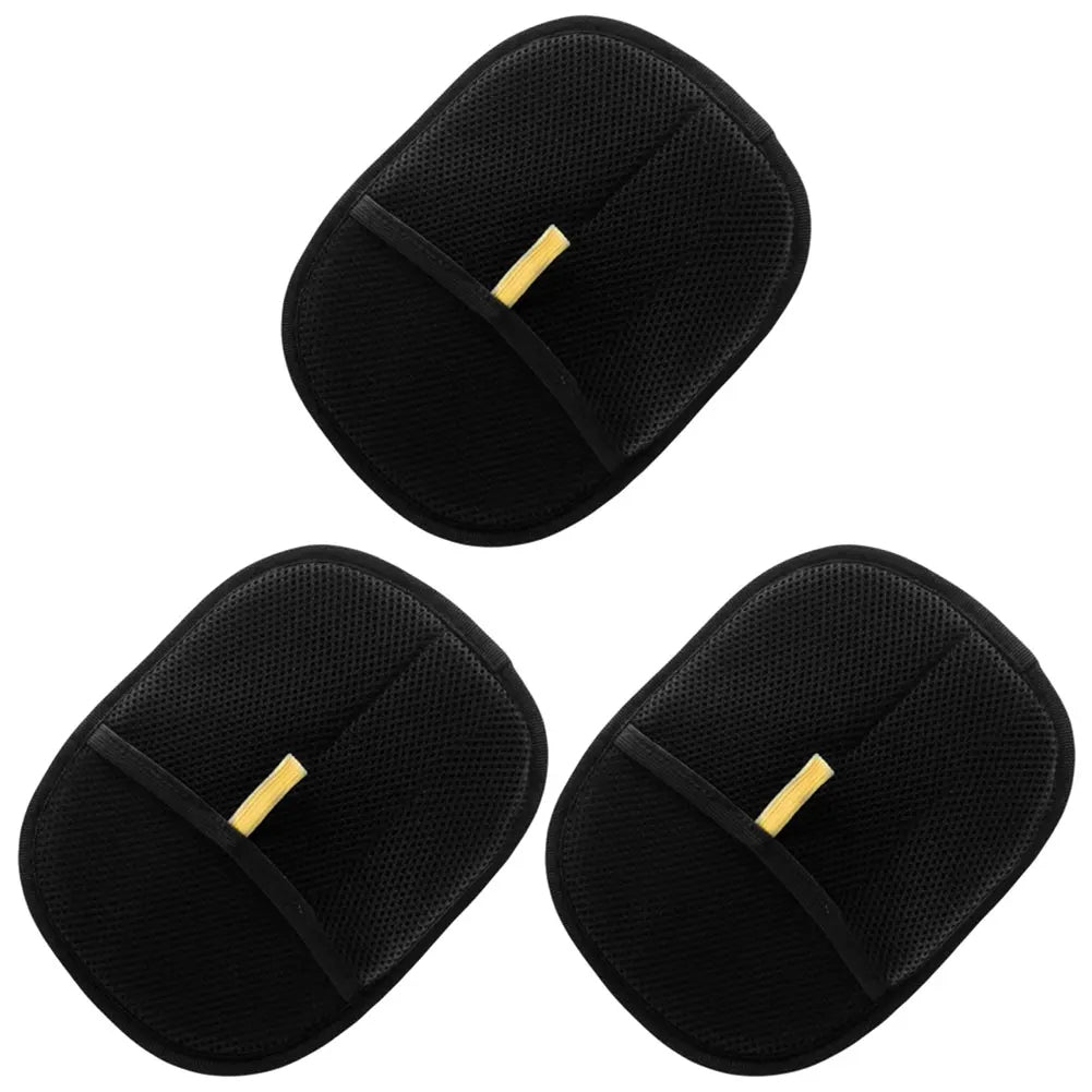 Three black pet hair brushes with gold accents on a white background